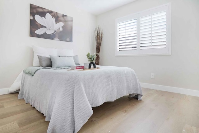 bedroom featuring light wood-type flooring