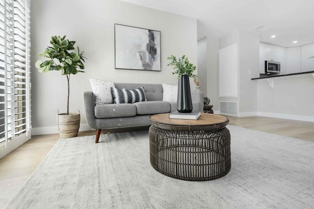 living room with light hardwood / wood-style floors