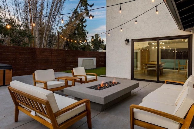 view of patio featuring an outdoor living space with a fire pit