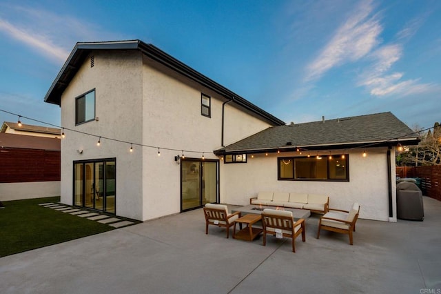 back of house with an outdoor hangout area and a patio area