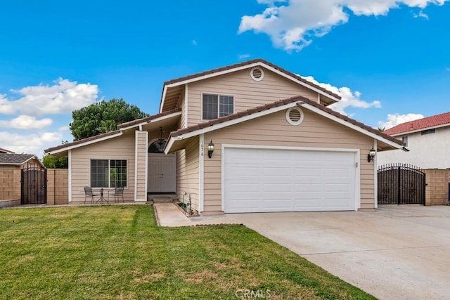 view of front of home featuring a garage and a front yard