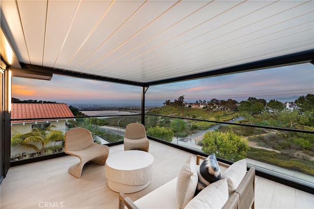 balcony at dusk with an outdoor living space