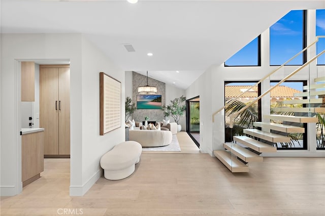 bathroom featuring lofted ceiling and wood-type flooring