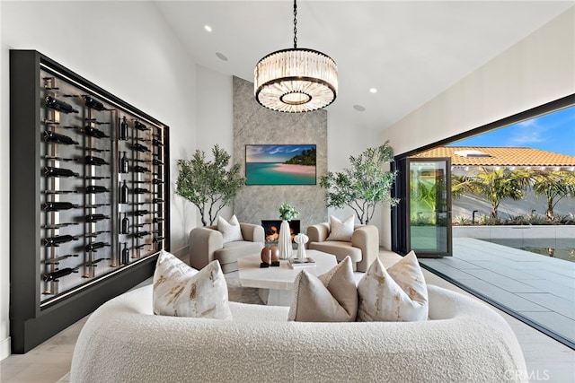 living room with light hardwood / wood-style flooring and a chandelier