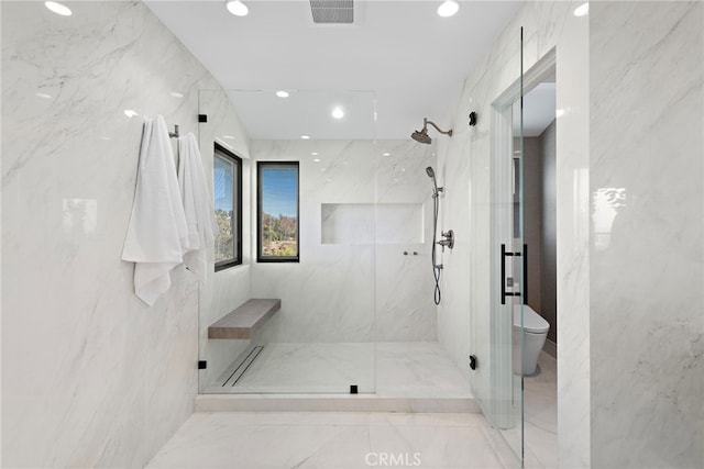 bathroom with toilet, tile walls, and walk in shower