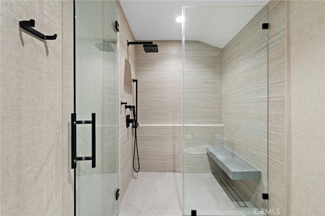 bathroom with vaulted ceiling and an enclosed shower