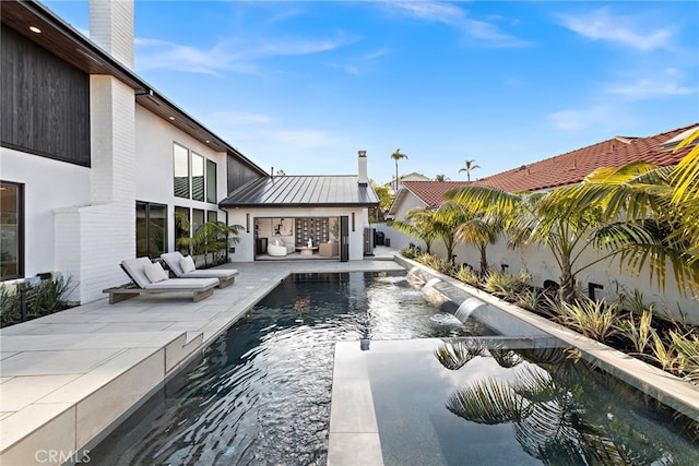 view of pool featuring a patio