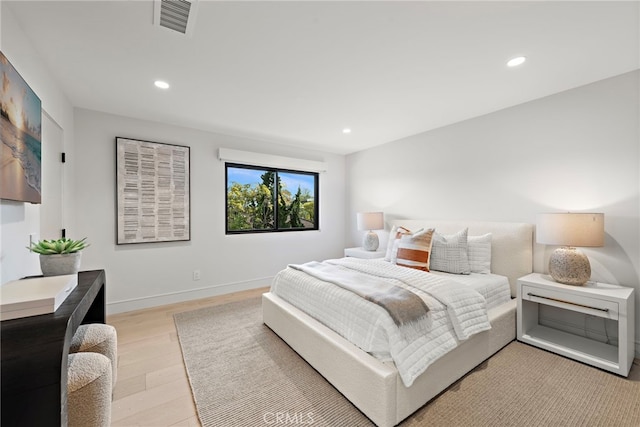 bedroom with light hardwood / wood-style floors