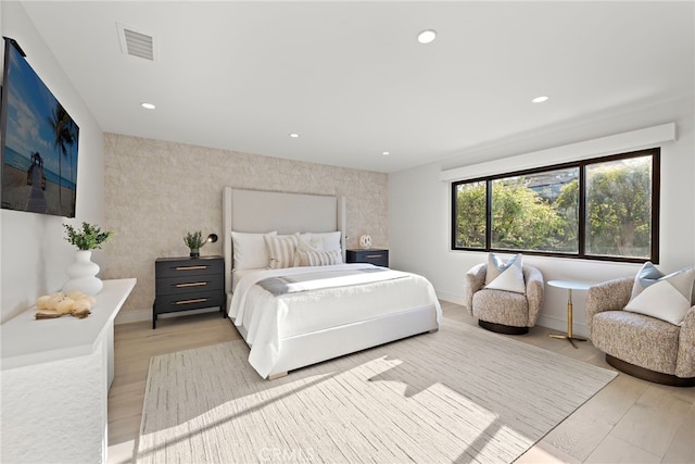 bedroom with light hardwood / wood-style flooring