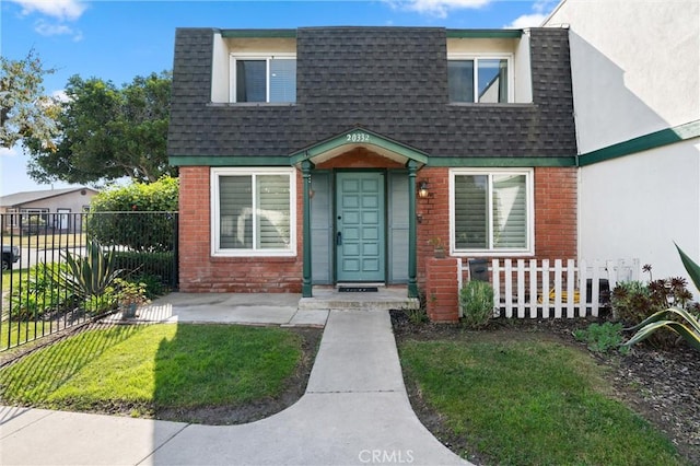 view of front of home with a front lawn