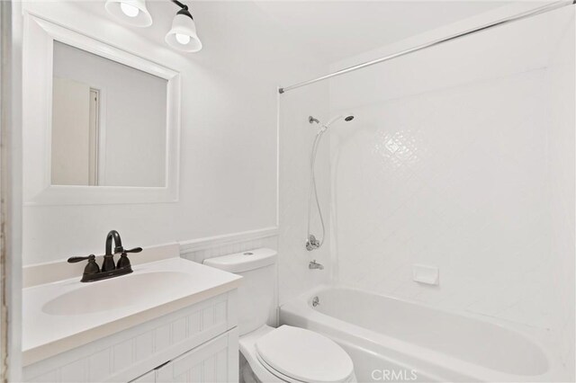 full bathroom with vanity, toilet, and washtub / shower combination