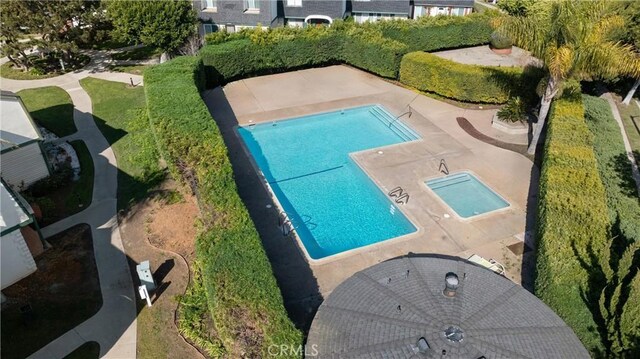 view of swimming pool with a patio area