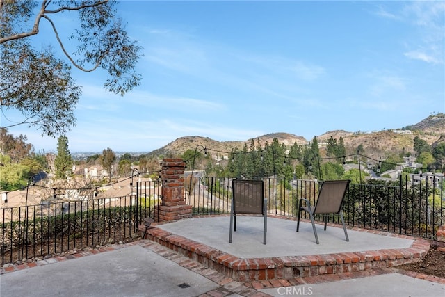 view of patio / terrace with a mountain view