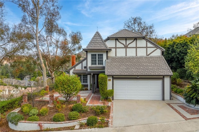 english style home with a garage