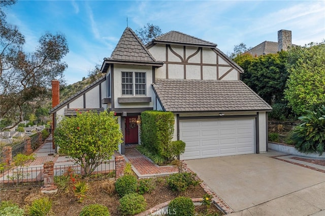 tudor home featuring a garage