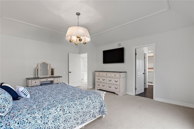 bedroom with a chandelier and carpet floors