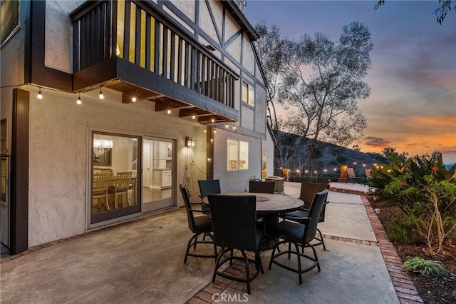 view of patio terrace at dusk