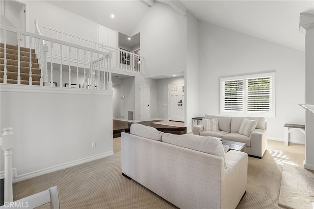 living room featuring light colored carpet and high vaulted ceiling