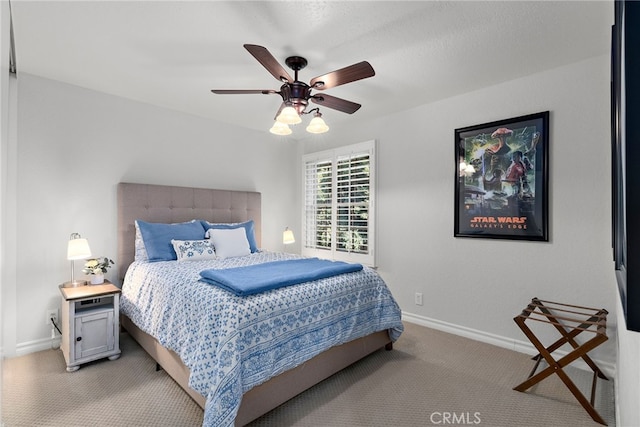 bedroom featuring light carpet and ceiling fan