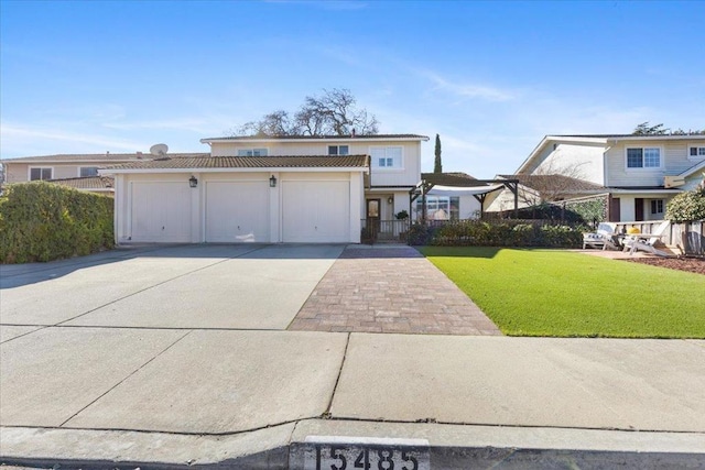 view of front of home featuring a garage and a front yard