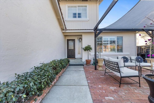 doorway to property featuring an outdoor hangout area and a patio area