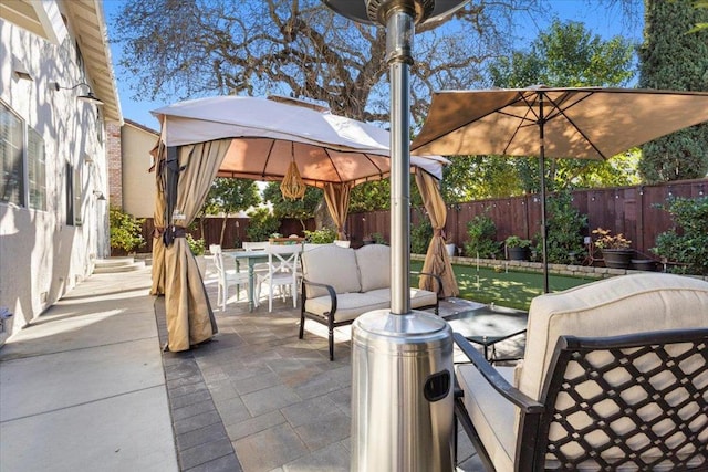 view of patio featuring a gazebo and an outdoor hangout area