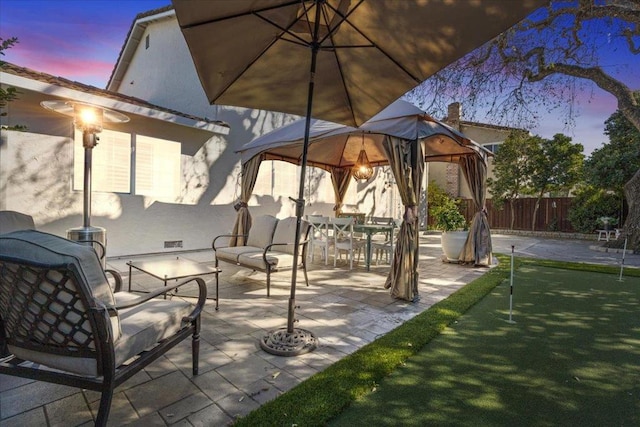 patio terrace at dusk with a gazebo