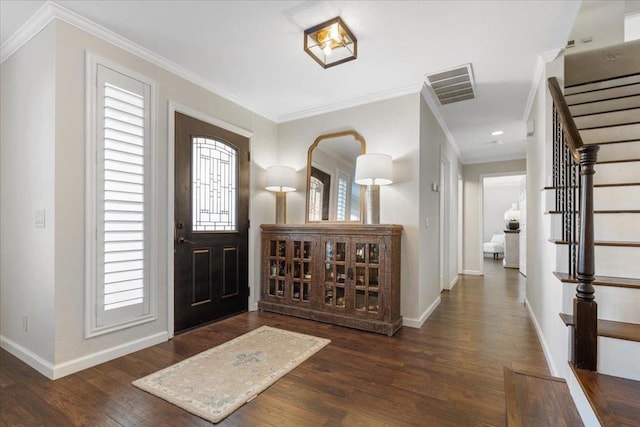 entryway with crown molding and dark hardwood / wood-style flooring