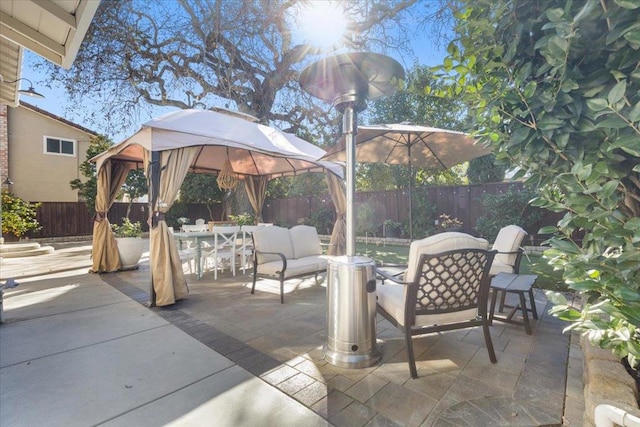 view of patio featuring a gazebo and an outdoor hangout area