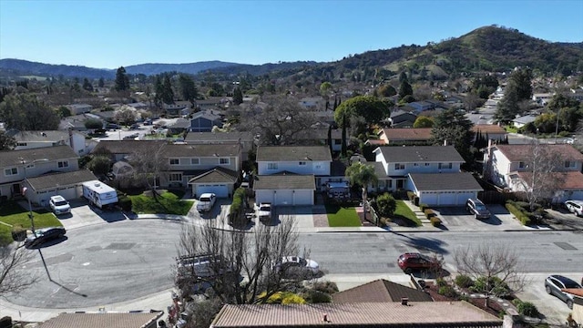 birds eye view of property featuring a mountain view