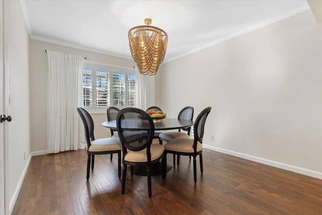 dining space with ornamental molding, dark hardwood / wood-style floors, and a notable chandelier