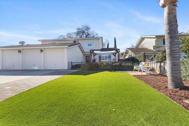 front of property with a garage and a front lawn