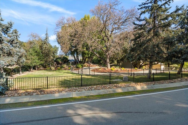 view of home's community featuring a lawn