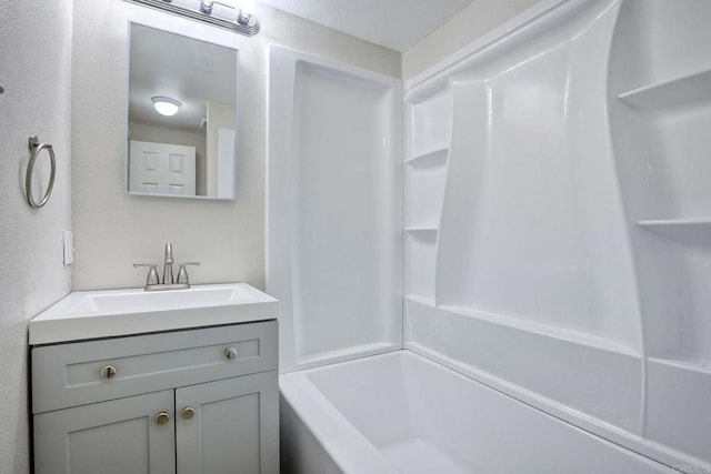 bathroom with vanity and tub / shower combination