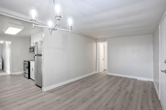 unfurnished room with light hardwood / wood-style floors