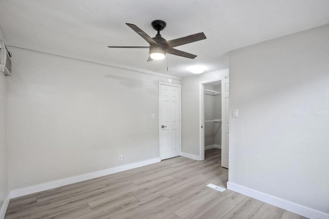 111416 N 1st St, El Cajon, CA 92021 - unfurnished bedroom with light wood-style floors, a walk in closet, a closet, baseboards, and ceiling fan