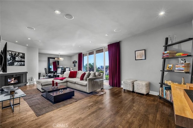 living room featuring expansive windows and hardwood / wood-style floors