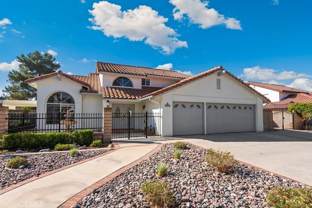 mediterranean / spanish-style home with a garage