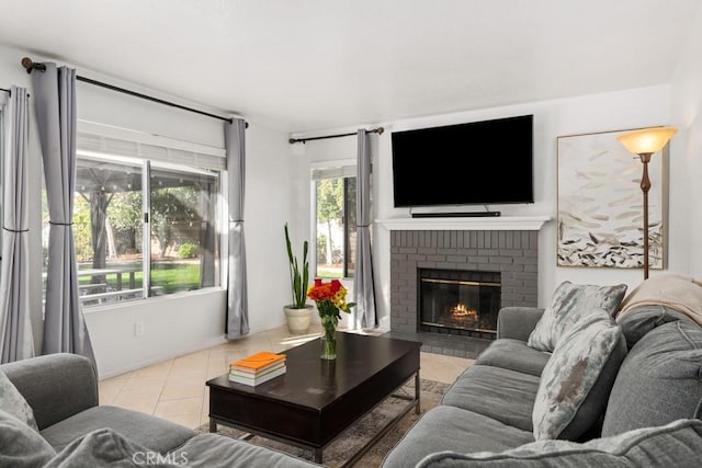 living room featuring a fireplace and light tile patterned floors