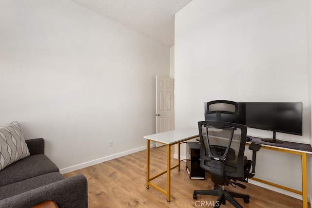 office with light wood-type flooring