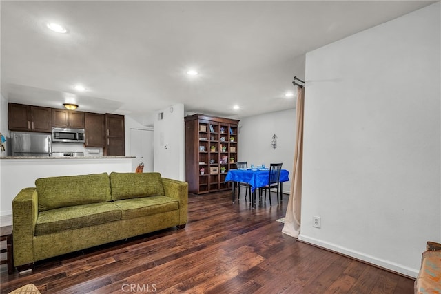 living room with dark wood-type flooring