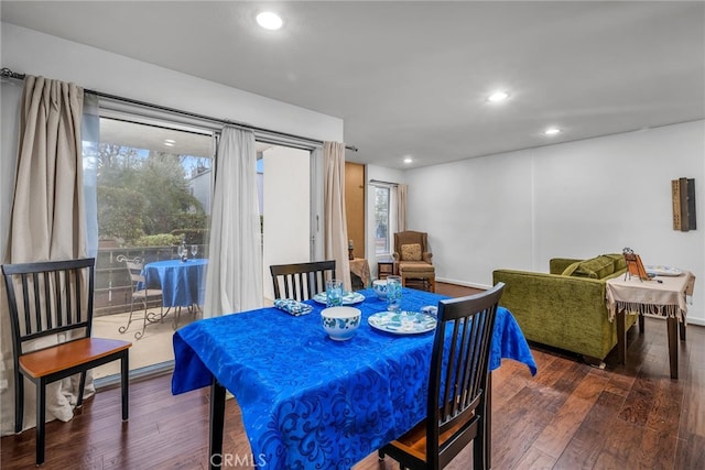 dining space featuring dark hardwood / wood-style floors