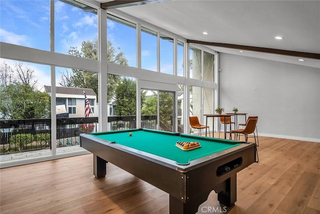 recreation room featuring light hardwood / wood-style flooring, beam ceiling, high vaulted ceiling, expansive windows, and pool table