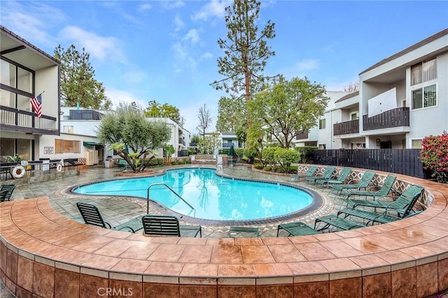 view of swimming pool with a patio area