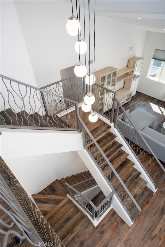 stairs with wood finished floors