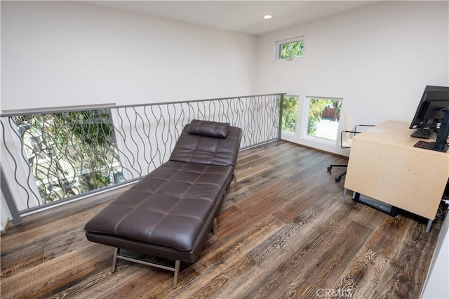 living area featuring dark wood finished floors and recessed lighting