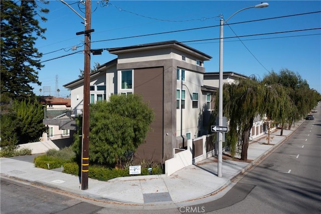 view of side of property featuring stucco siding