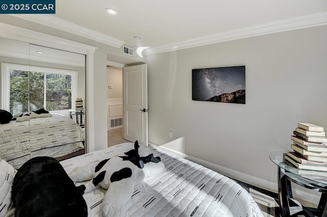 bedroom with access to outside, ornamental molding, and wood-type flooring