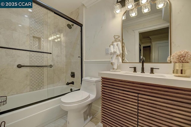 full bathroom with vanity, crown molding, toilet, and combined bath / shower with glass door