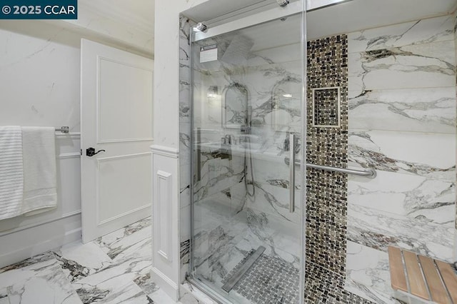 bathroom featuring a shower with shower door